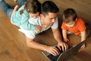 Todder Boy, Preschool Girl, with Dad Looking at Laptop